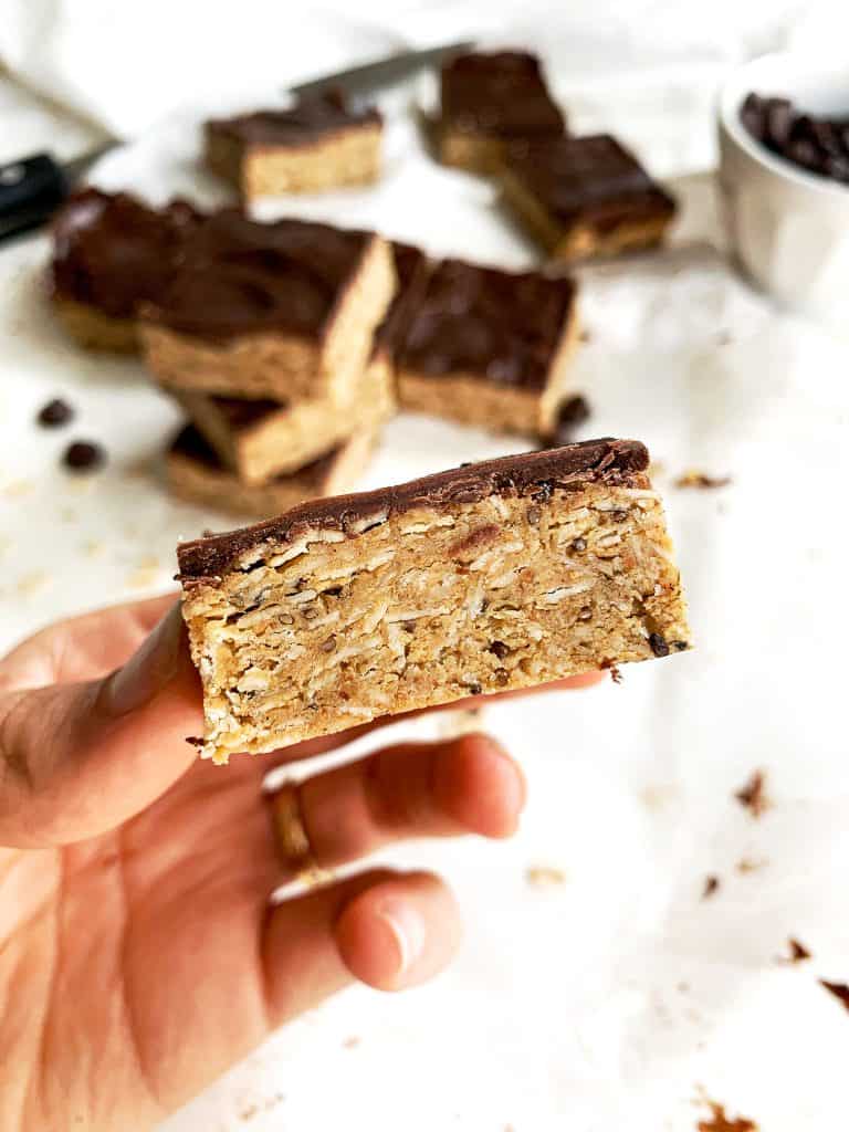 Healthy no-bake peanut butter oatmeal protein bars are packed with fiber, protein, and healthy fats to keep you full and satisfied. Using less than ten clean ingredients, the pickiest of eaters won't even realize these protein bars are healthy! Indulge your sweet tooth while nourishing your body at the same time. #proteinbars #nobake #healthyrecipes Healthy No Bake Peanut Butter Oatmeal Protein Bars