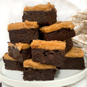 stack of vegan pumpkin brownies on white plate
