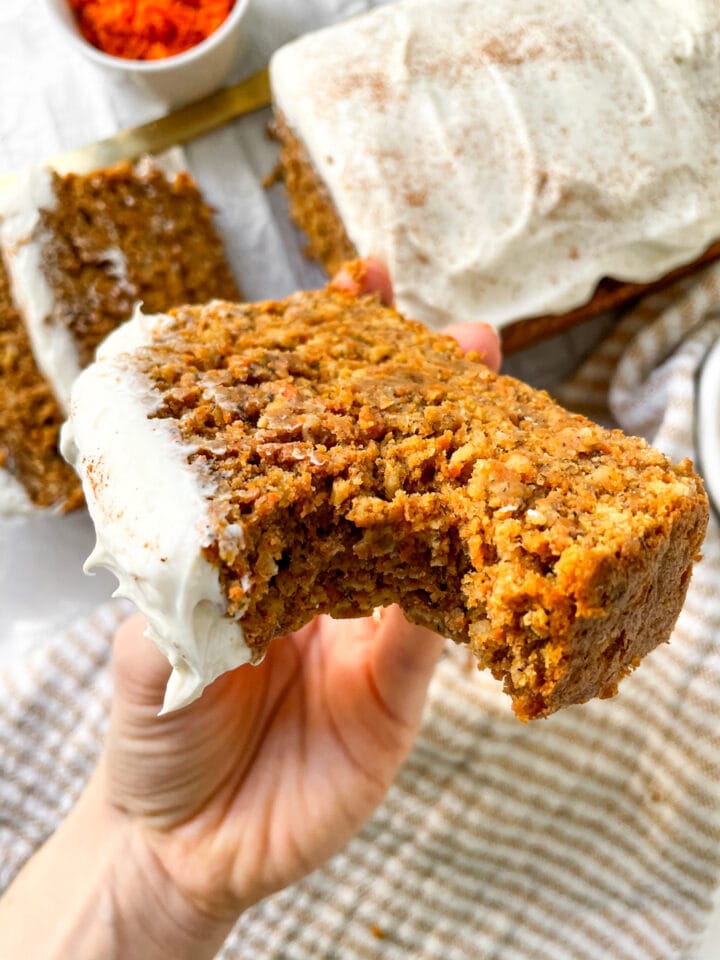Close up of dairy free carrot cake banana bread with bite taken out of it