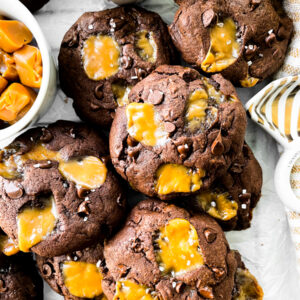 caramel chocolate cookies next to a bowl of caramel candies