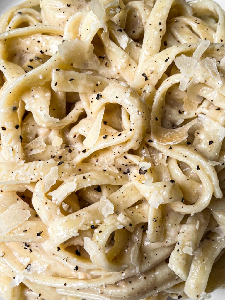 close up of alfredo and noodles
