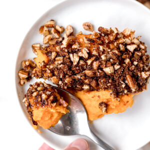 close up of paleo sweet potato casserole on a small round white plate