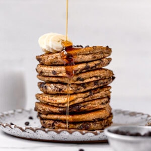 stack of chocolate chip protein pancakes with bananas on top