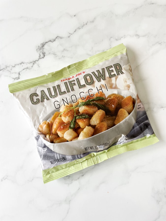 Bag of trader joes cauliflower gnocchi on a marble background