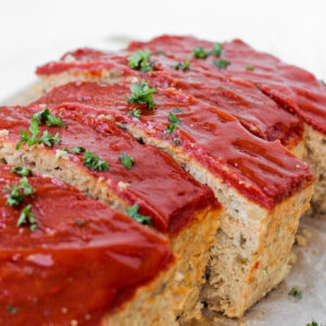 whole30 meatloaf sliced topped with ketchup