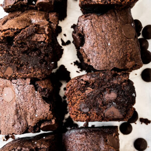 a half batch of diary free brownies resting on parchment paper