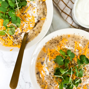 two bowls of 4 ingredient potato soup with toppings