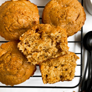 top view of carrot apple muffins cooling on a wire rack