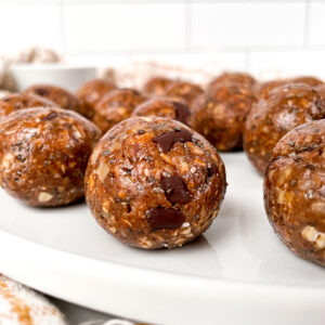 side shot of vegan protein balls on a white tray